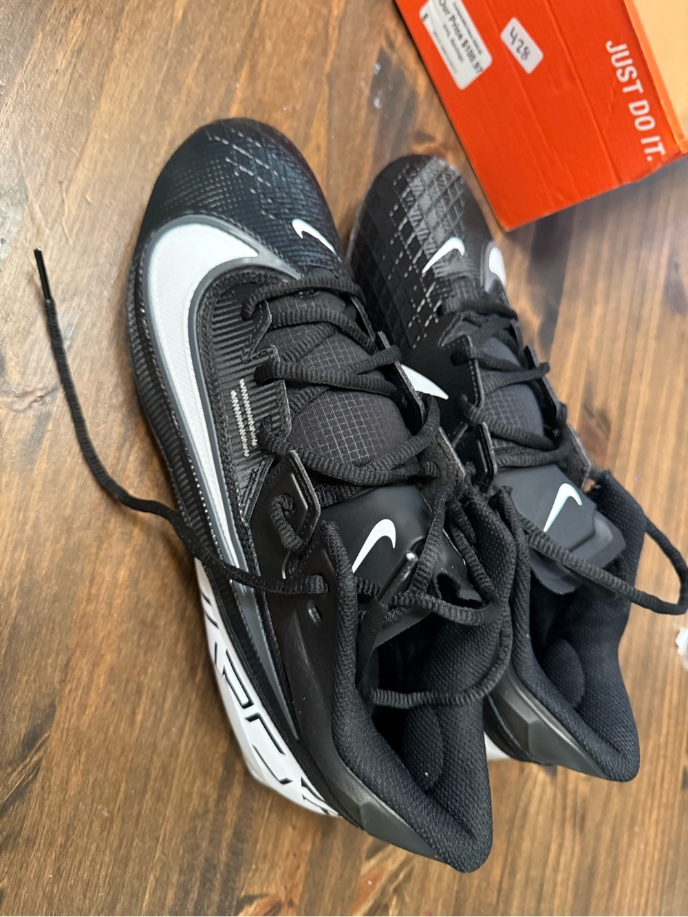 Nike Men’s Black and White Athletic cleats size 10